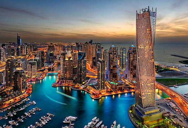 Dubai Marina from a high view showing the boats, sea, and the city scape.